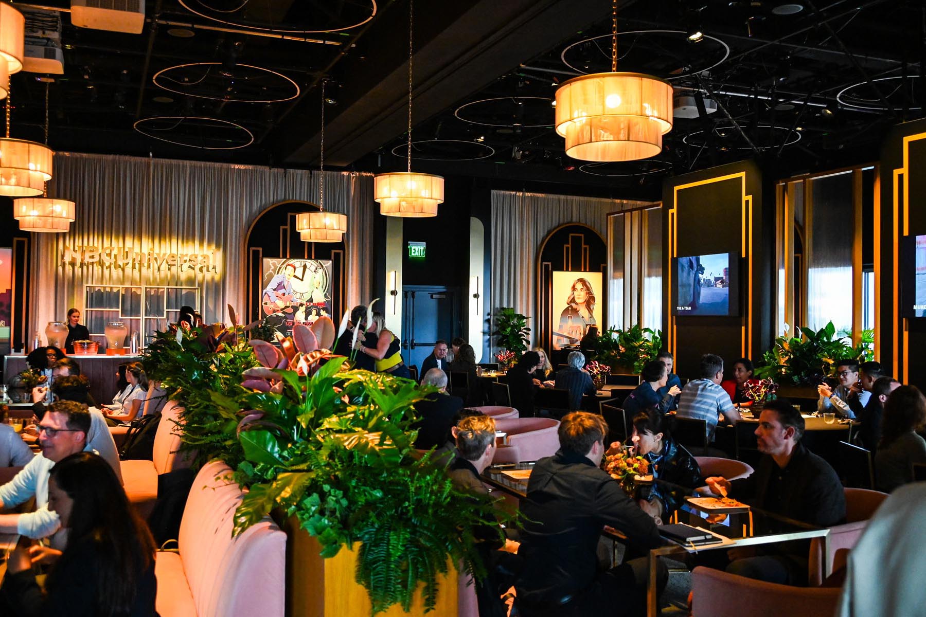 nbcu-la-screenings-2026-event-interior-00 Elegant restaurant filled with guests.