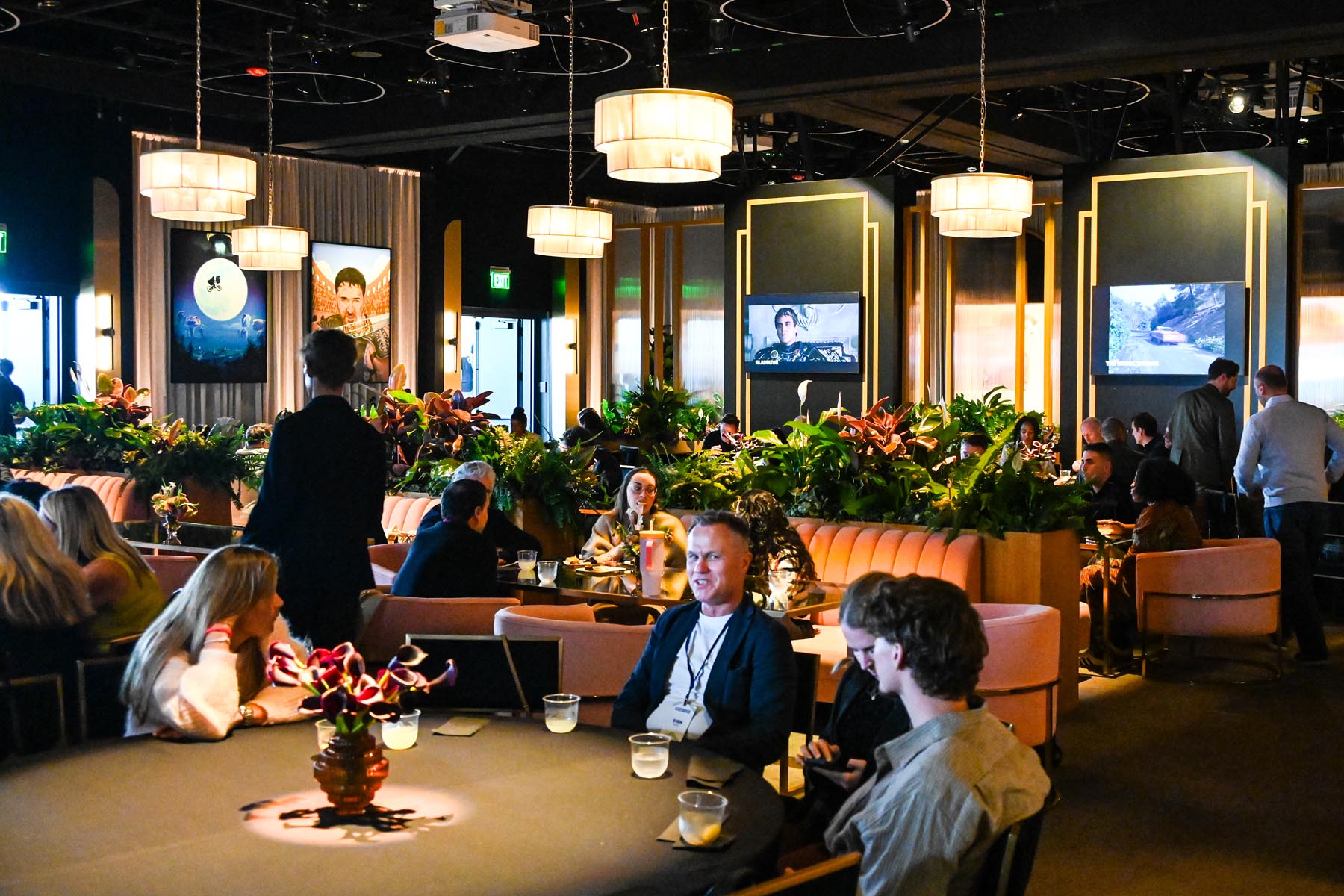 nbcu-la-screenings-2026-event-interior-09 Elegant dining area with guests socializing.