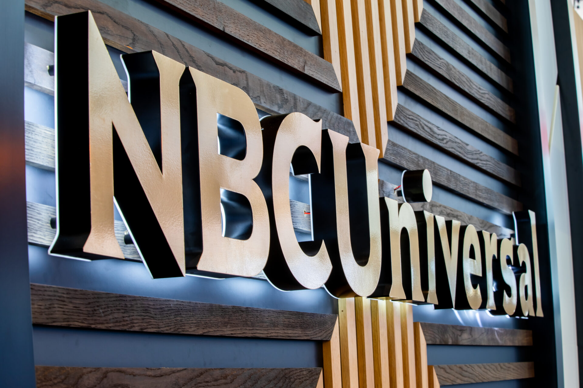 NBCUniversal logo on wooden background