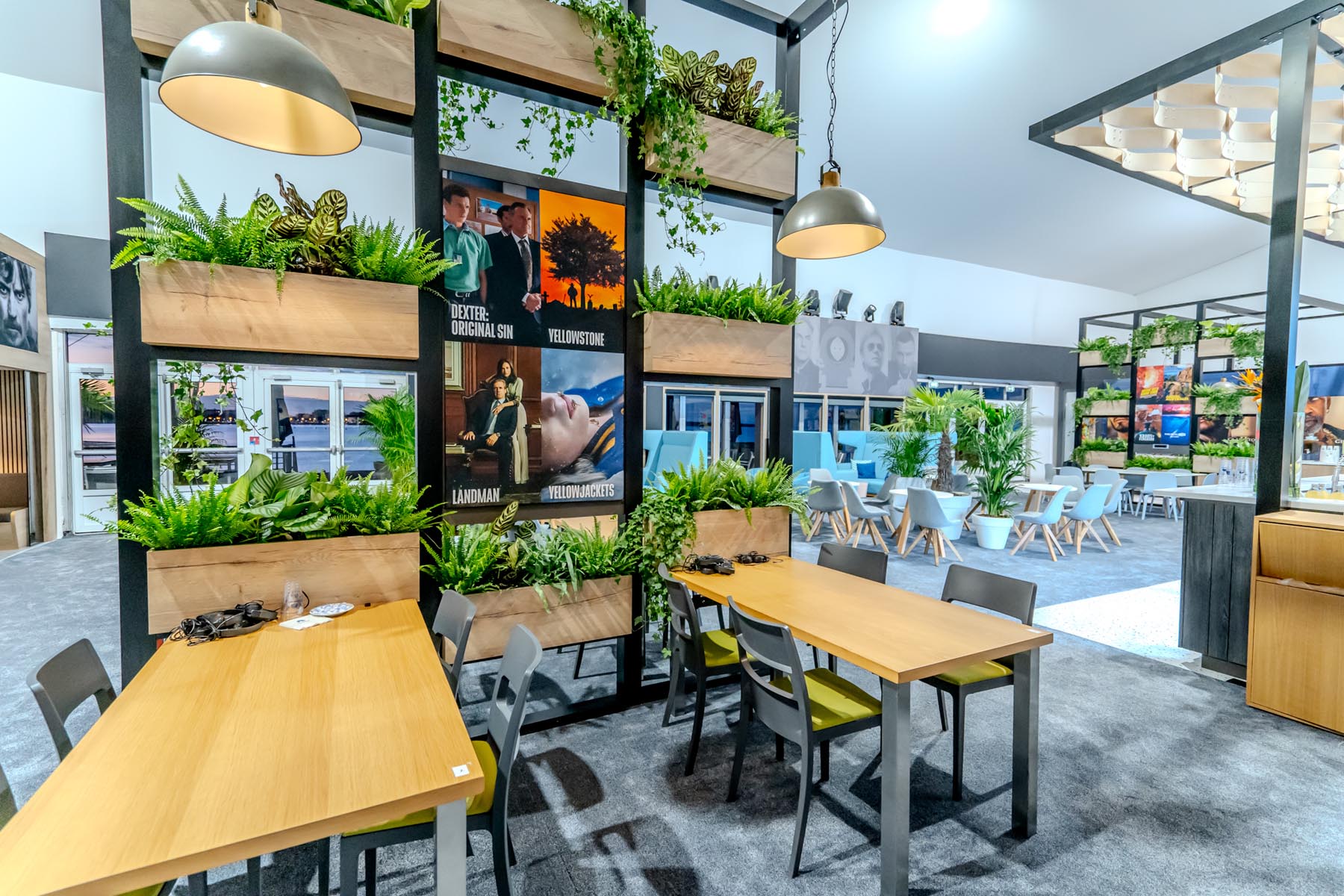 Modern exhibition space with greenery.