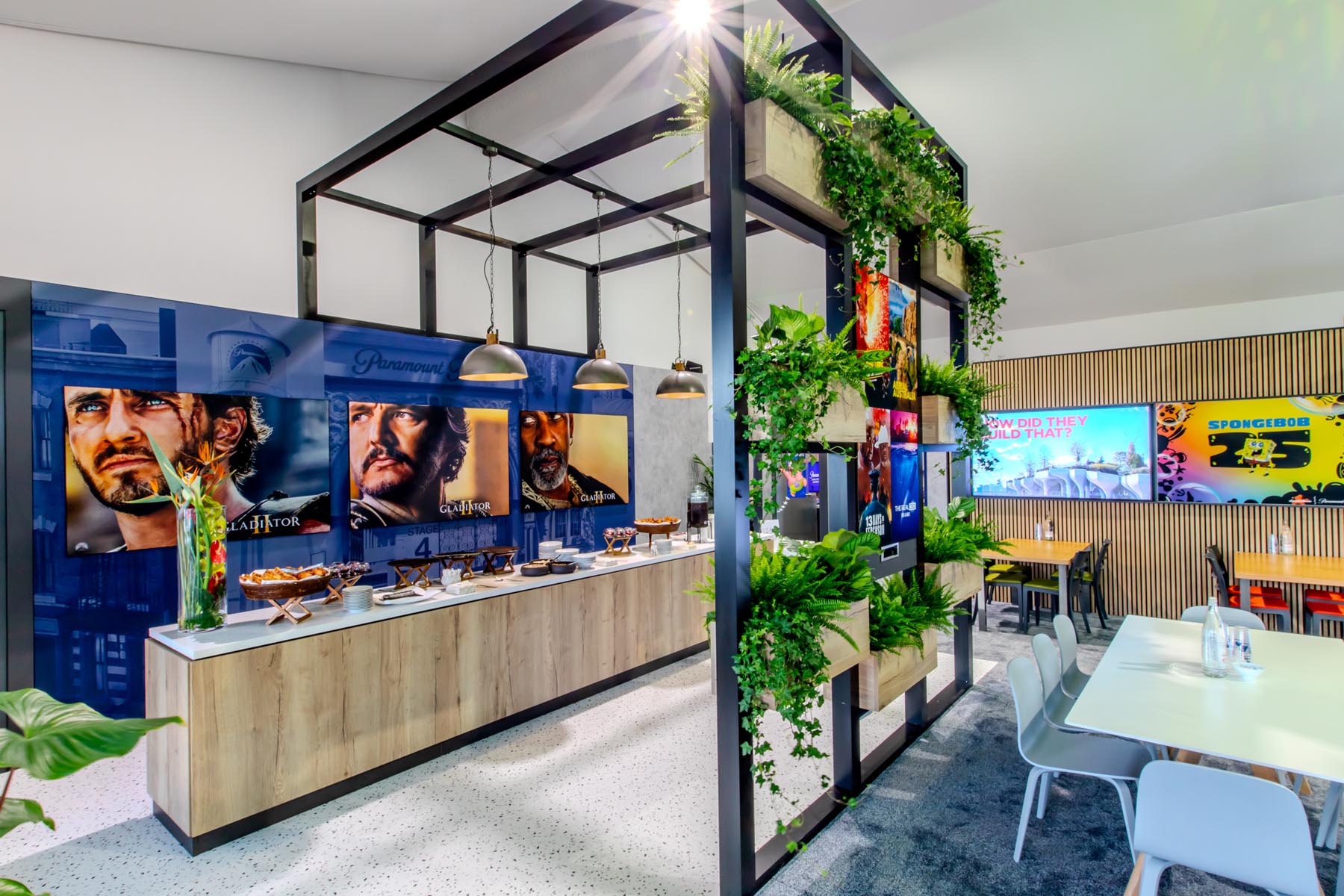Modern exhibition space with greenery.