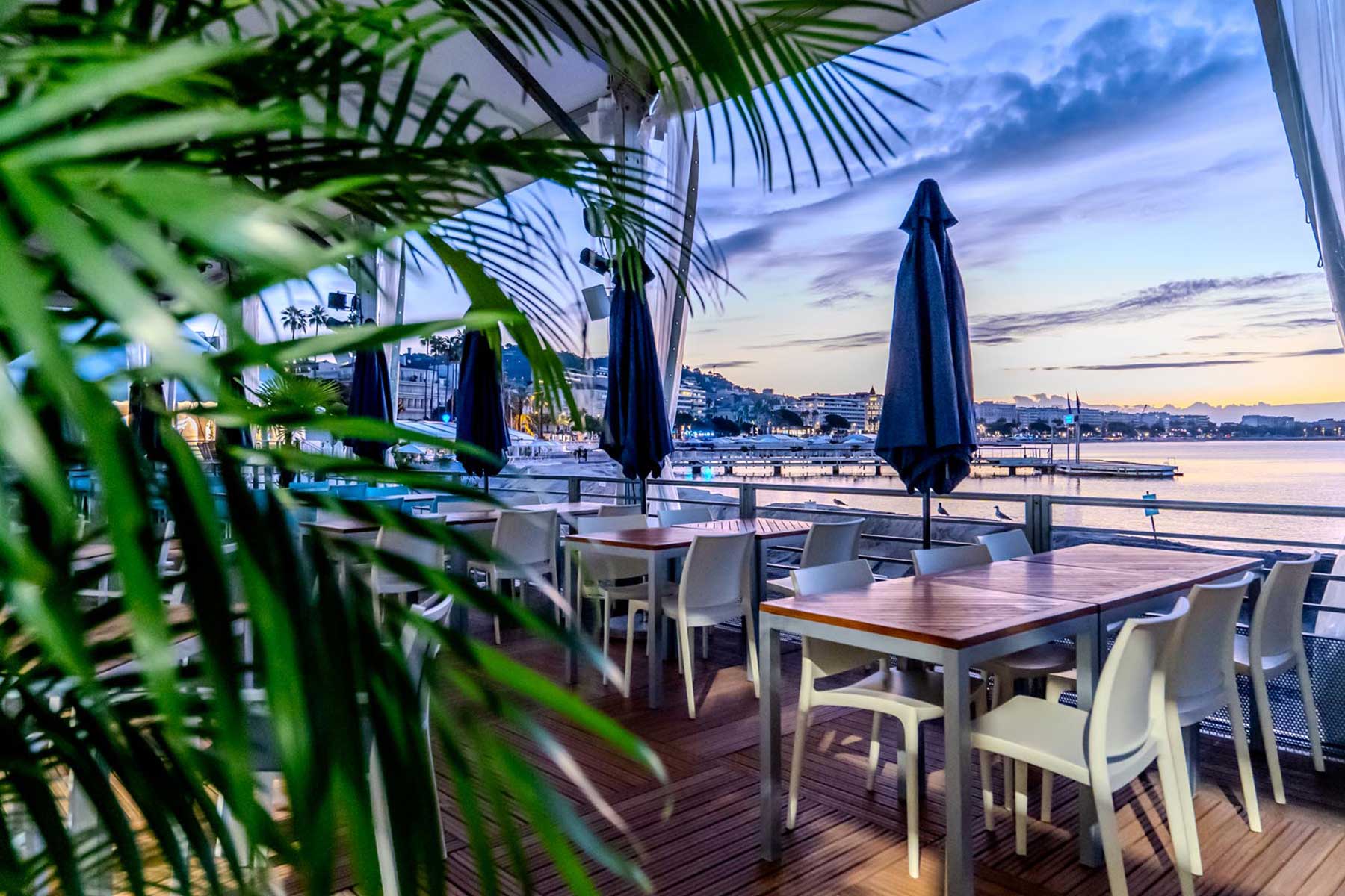 Outdoor dining with scenic waterfront view