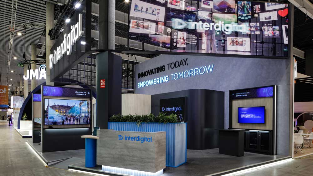 interdigital4 Modern exhibition booth with branding.