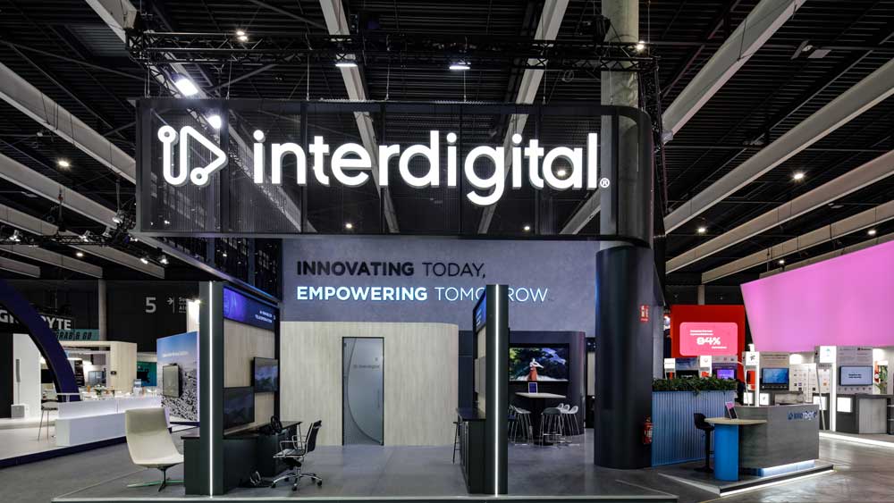 interdigital5 Modern exhibition booth with branding.